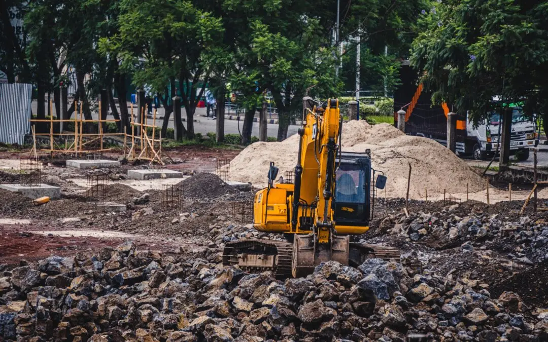 Graafmachine tijdens bodemwerkzaamheden, passend bij de wijzigingen uit het Verzamelbesluit Omgevingswet 2026.